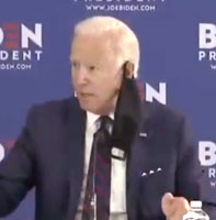 Biden with a mask hanging from his ear