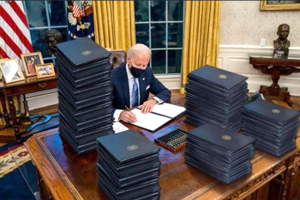 Biden signs a stack of unilateral edicts and decrees